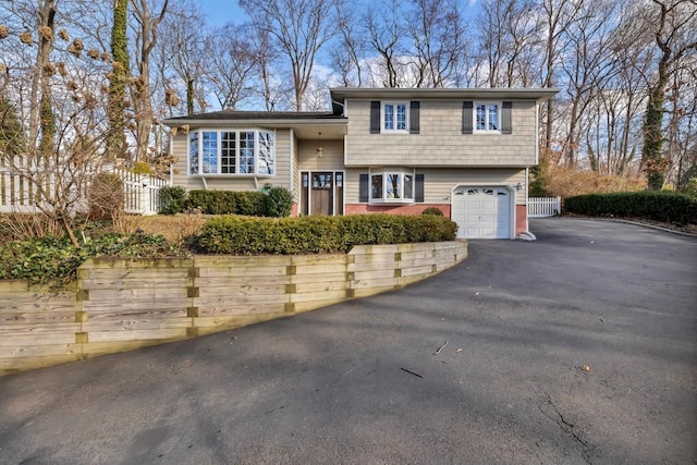 split level home with a garage