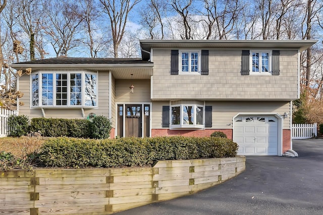 split level home with a garage