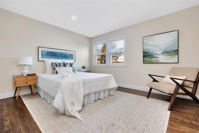 bedroom with hardwood / wood-style flooring