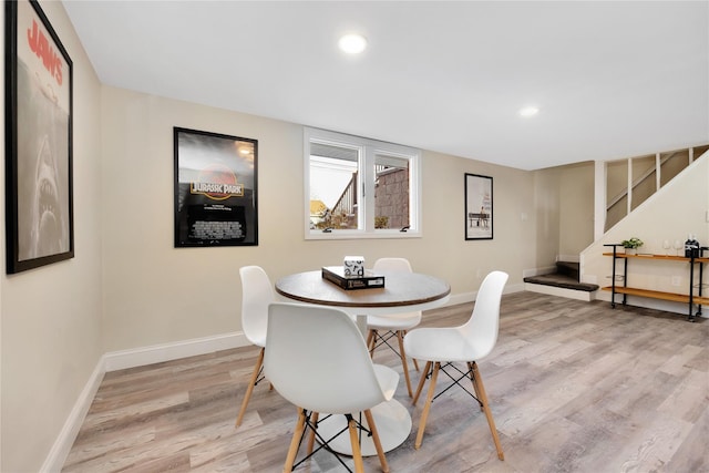 dining area with light hardwood / wood-style floors