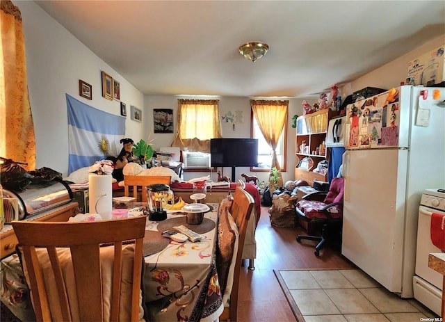 dining space with light wood-type flooring