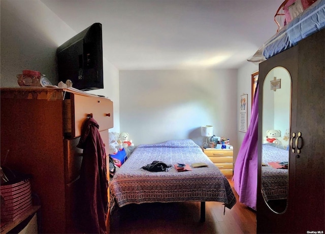 bedroom featuring wood-type flooring