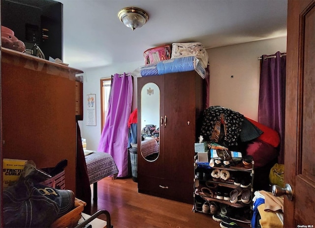 bedroom with hardwood / wood-style flooring