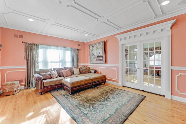 living room with french doors, coffered ceiling, and hardwood / wood-style floors