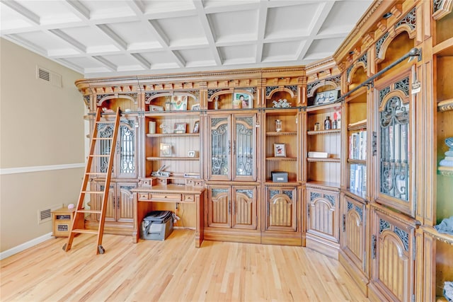 office featuring beamed ceiling, coffered ceiling, and light wood-type flooring