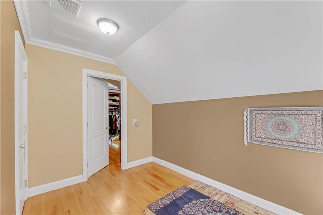 bonus room featuring hardwood / wood-style flooring and lofted ceiling