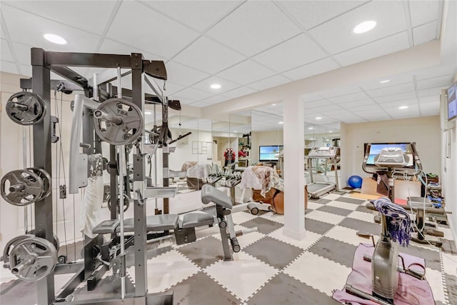 exercise room featuring a drop ceiling