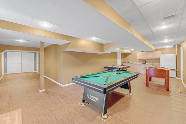 game room featuring a paneled ceiling, pool table, and light wood-type flooring