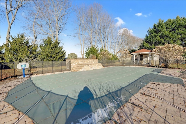 view of pool featuring an outbuilding