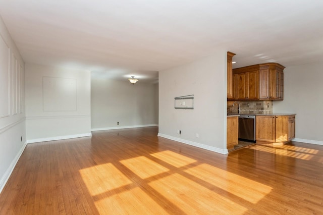 unfurnished living room with light wood-type flooring