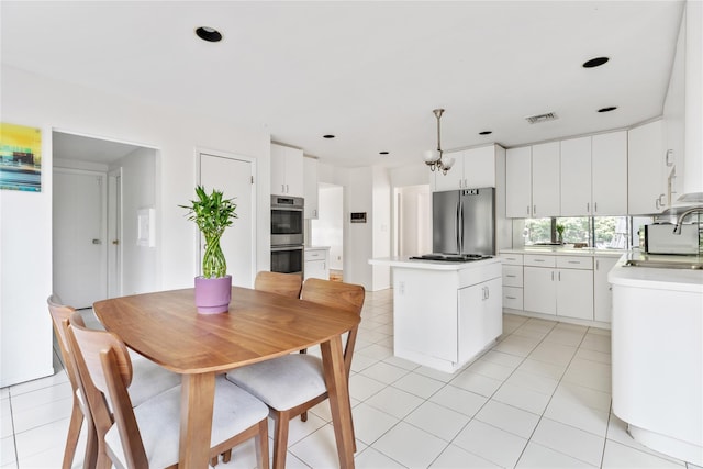 dining space featuring light tile patterned flooring