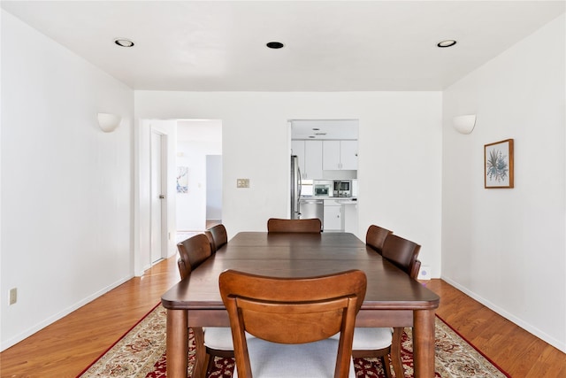 dining area with light hardwood / wood-style flooring