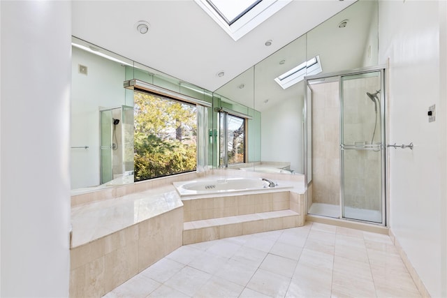 bathroom featuring tile patterned flooring, lofted ceiling with skylight, and shower with separate bathtub