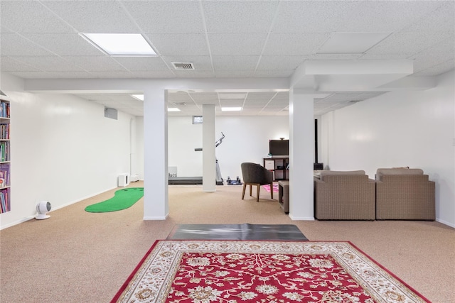 basement featuring a paneled ceiling