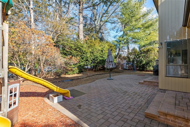 view of patio with a playground