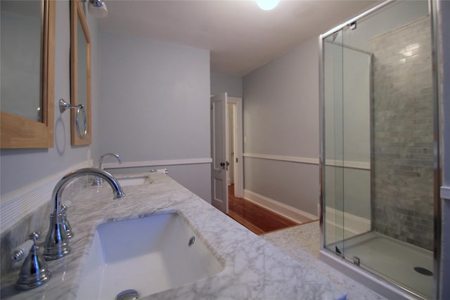 bathroom with vanity and an enclosed shower