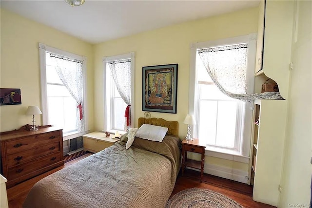 bedroom featuring dark wood-type flooring