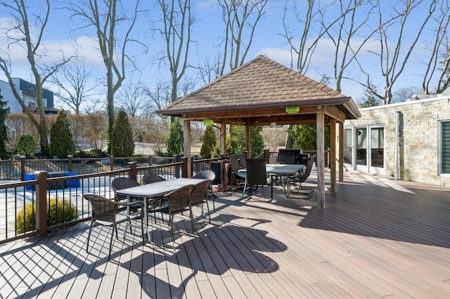 deck with a gazebo and a covered pool