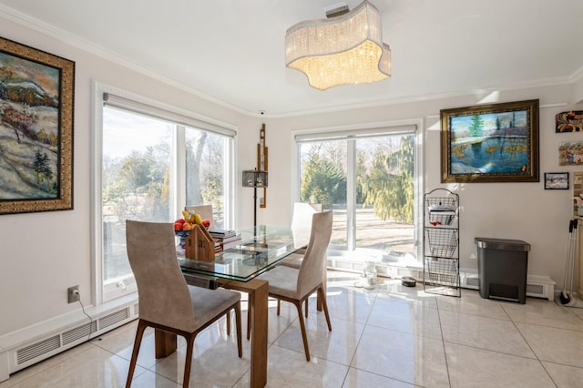 dining space featuring crown molding, a baseboard radiator, and plenty of natural light