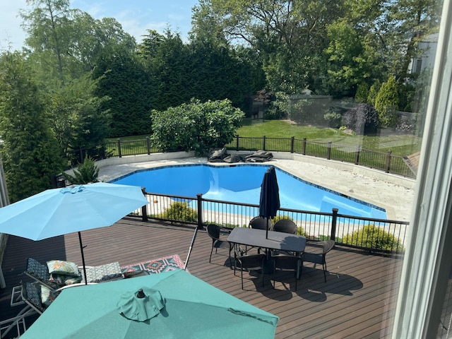 view of swimming pool featuring a wooden deck