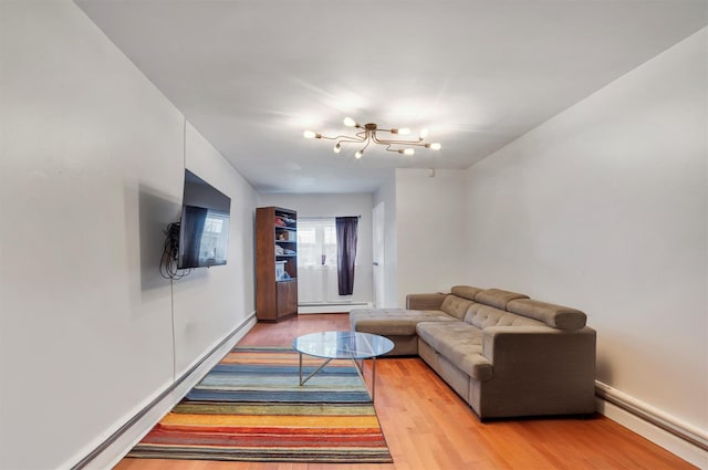 living room featuring hardwood / wood-style flooring and a baseboard radiator