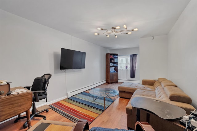 home office with a baseboard radiator, hardwood / wood-style floors, and a notable chandelier