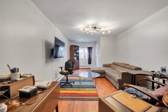 living room with a baseboard radiator and hardwood / wood-style floors