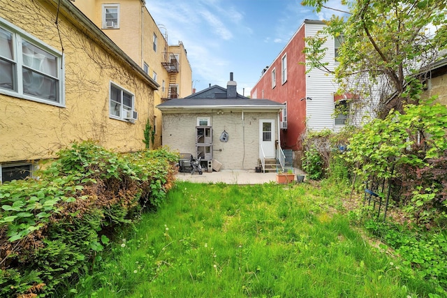 back of property featuring a patio