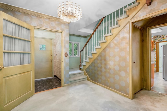 18 Kent Rd, Scarsdale, NY 10583 - carpeted entrance foyer with wallpapered walls, a chandelier, and stairway