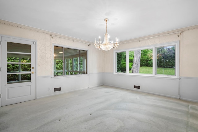 18 Kent Rd, Scarsdale, NY 10583 - carpeted empty room with a chandelier and plenty of natural light
