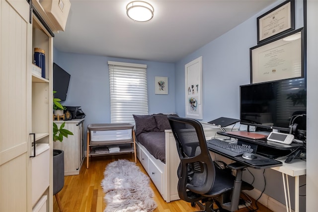 bedroom with light hardwood / wood-style floors