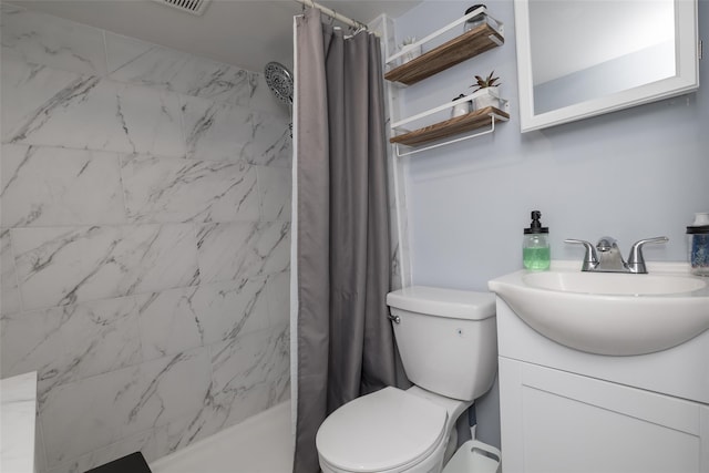 bathroom featuring vanity, toilet, and a shower with shower curtain