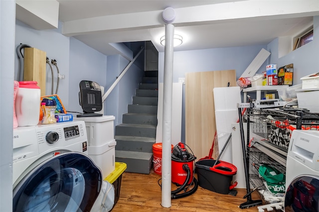 clothes washing area featuring washer / dryer and wood-type flooring