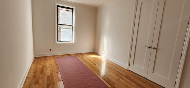 unfurnished room with light hardwood / wood-style flooring