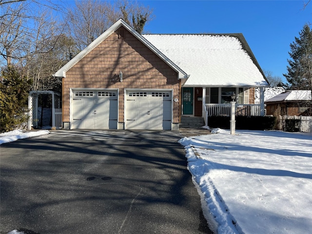 view of front facade with a porch and a garage