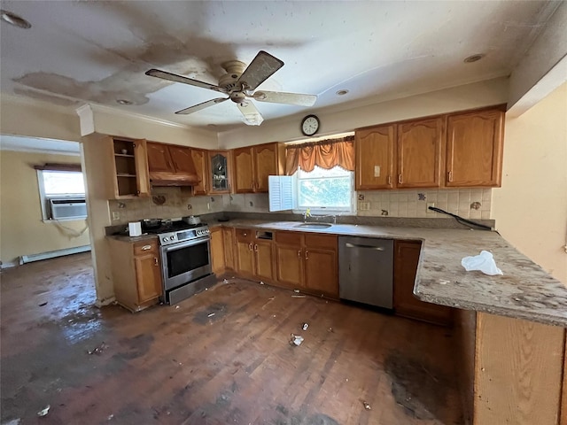 kitchen with appliances with stainless steel finishes, dark hardwood / wood-style floors, sink, custom exhaust hood, and a baseboard heating unit