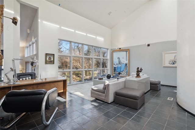 living room with a towering ceiling