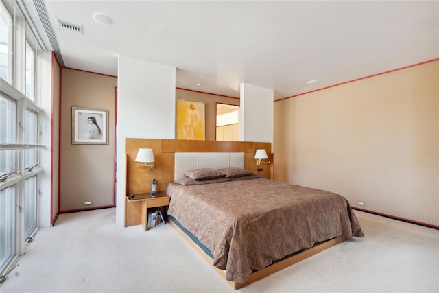 bedroom featuring light carpet