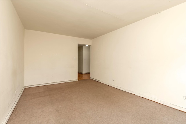 unfurnished room featuring carpet