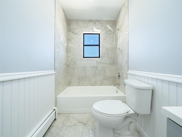 bathroom featuring tiled shower / bath, toilet, and a baseboard heating unit