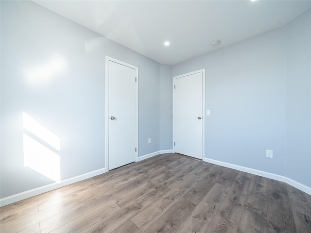 unfurnished room featuring hardwood / wood-style floors