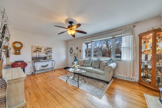 living room featuring visible vents, ceiling fan, and hardwood / wood-style floors