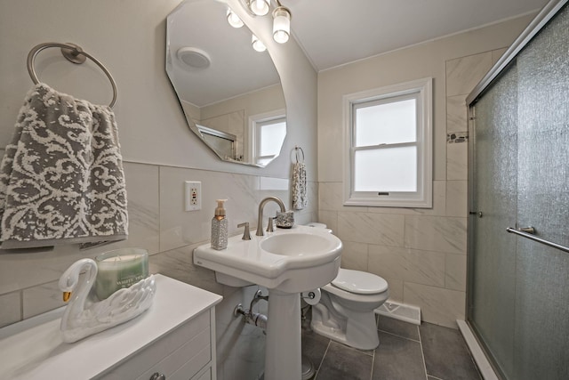 full bath featuring a stall shower, tile patterned flooring, tile walls, and toilet