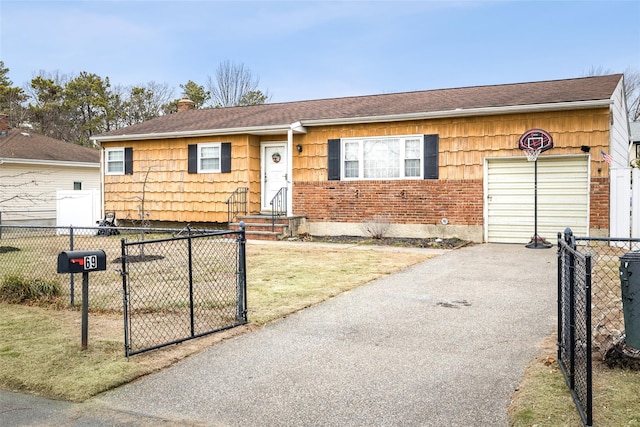 ranch-style house featuring a garage and a front lawn