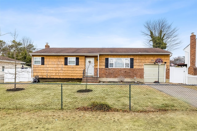 single story home featuring a garage and a front lawn