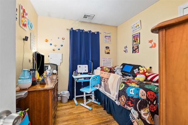 bedroom with light hardwood / wood-style flooring