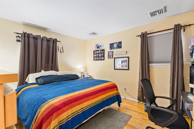 bedroom featuring wood-type flooring