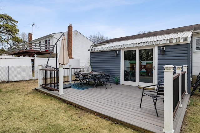 wooden deck with a yard