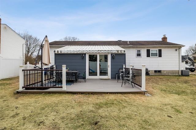 back of property featuring cooling unit, a yard, and a deck