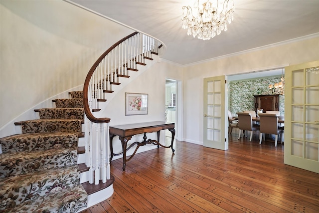 staircase featuring crown molding, wood-type flooring, and french doors